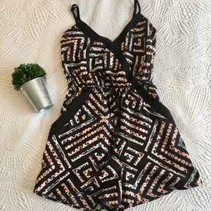 Fire Los Angeles Black Geometric Romper with Peach and Teal Accents